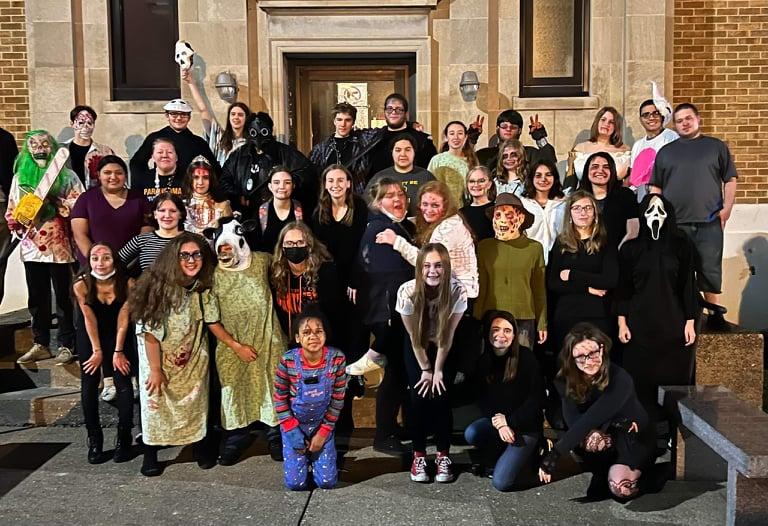 Group of teens dressed in Haunting costumes