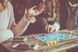 people playing a board game 