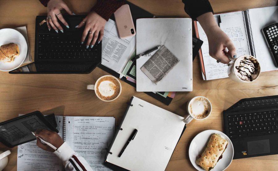 people working at a cafe 